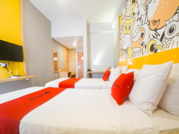 RedDoorz Apartment near Bundaran Satelit Surabaya : photo 7 de la chambre chambre lits jumeaux