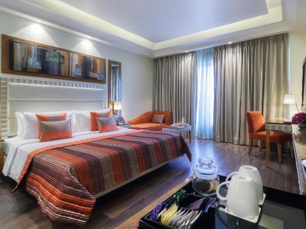 Ramada Gurgaon Central : photo 1 de la chambre premium queen room - non-smoking with happy hours (1+1 ;only applicable for imfl not all the brand at the bar),15% discount on f&b,inr 500 spa credit, early check-in for 03 hours