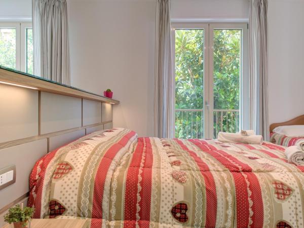 Alloggio Nella : photo 3 de la chambre chambre triple - vue sur jardin