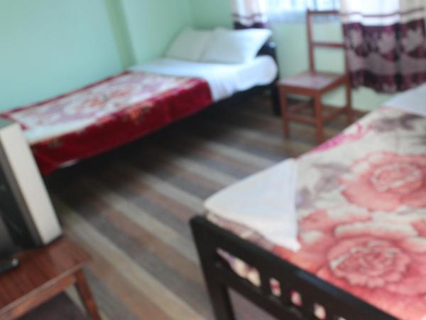 Harry Guest House & Restaurant : photo 10 de la chambre chambre triple Économique