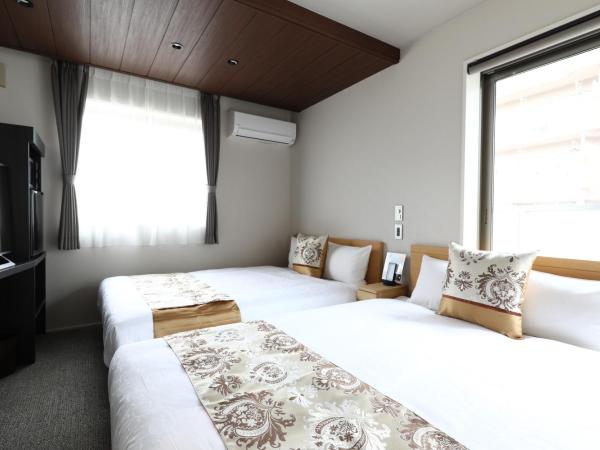 GRAND BASE Hakata City : photo 1 de la chambre chambre lits jumeaux standard