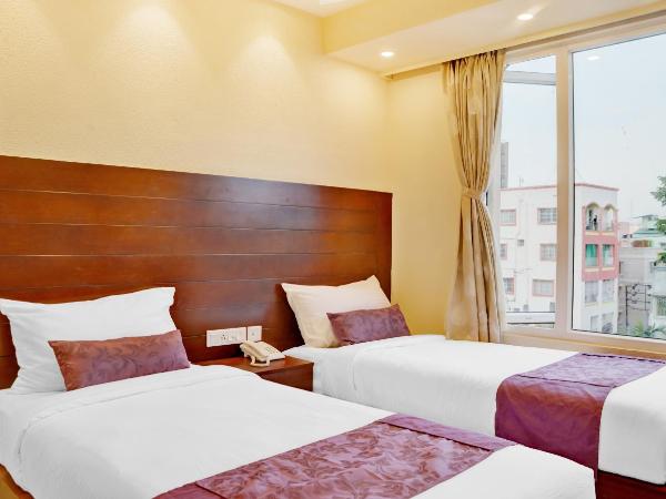 Treebo Premium The Crystal : photo 4 de la chambre [sanitized] standard twin room