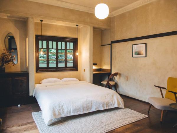 Guesthouse toco : photo 1 de la chambre chambre lit queen-size avec balcon