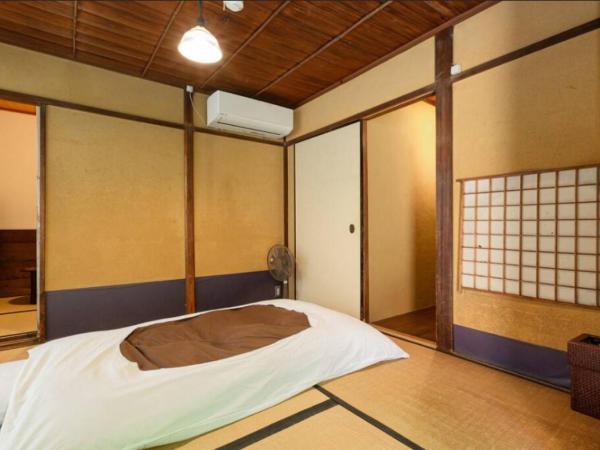 Guest House Koiya : photo 4 de la chambre chambre triple de style japonais avec jardin - rez-de-chaussée