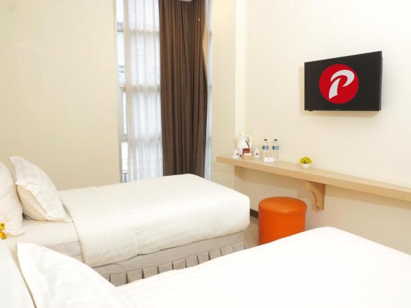 d'primahotel Melawai - Blok M : photo 3 de la chambre chambre deluxe double ou lits jumeaux