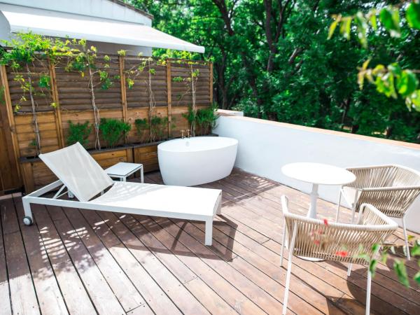 Hotel Legado Alcazar : photo 6 de la chambre hébergement premium royal alcazar avec terrasse et baignoire extérieure