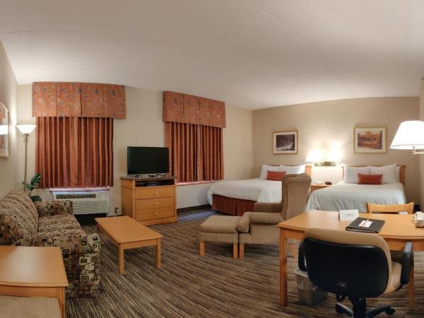 Humphry Inn and Suites : photo 1 de la chambre suite lit queen-size