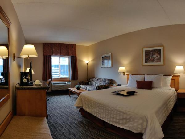 Humphry Inn and Suites : photo 4 de la chambre chambre lit king-size avec bureau