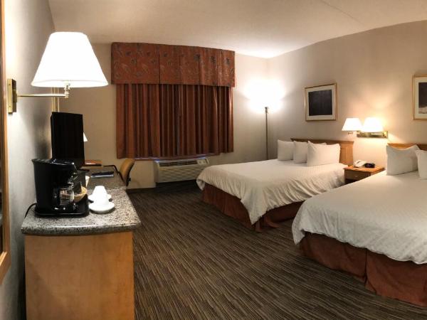 Humphry Inn and Suites : photo 6 de la chambre chambre lit queen-size