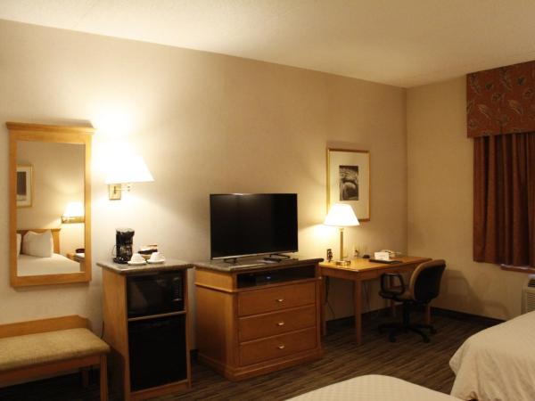 Humphry Inn and Suites : photo 9 de la chambre chambre lit queen-size