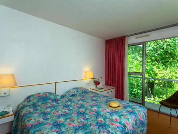 Hôtel Restaurant Pavillon Carina : photo 1 de la chambre chambre lits jumeaux