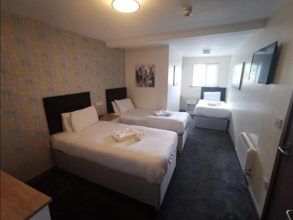 The Avenue Club and Lodge : photo 1 de la chambre chambre triple standard