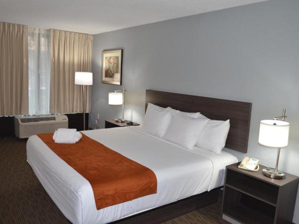 Days Inn & Suites by Wyndham Orlando Airport : photo 1 de la chambre chambre lit king-size - non-fumeurs