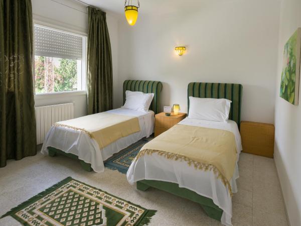 Villa Phoenicia : photo 3 de la chambre chambre lits jumeaux smeraldo 
