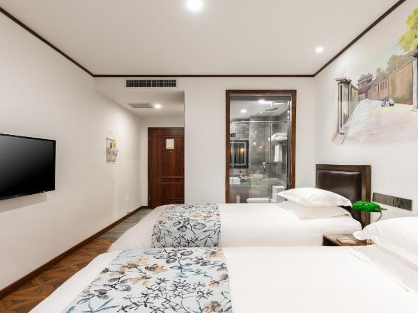 Time Traveller Hotel - Near Prince Gong's Mansion, Beihai Park, Tian'anmen Square, Nanluoguxiang Hutong, Huguosi Hutong Snack Street, 5 minutes walk away from Ping'anli Subway Station, Free ice cream and laundry service,English communication well : photo 2 de la chambre chambre lits jumeaux supérieure