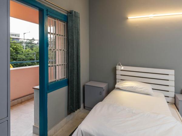 Woke HSR layout : photo 3 de la chambre lit simple dans dortoir pour hommes avec salle de bains commune