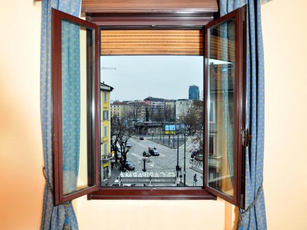 Hotel San Guido : photo 5 de la chambre chambre double ou lits jumeaux avec lit d'appoint