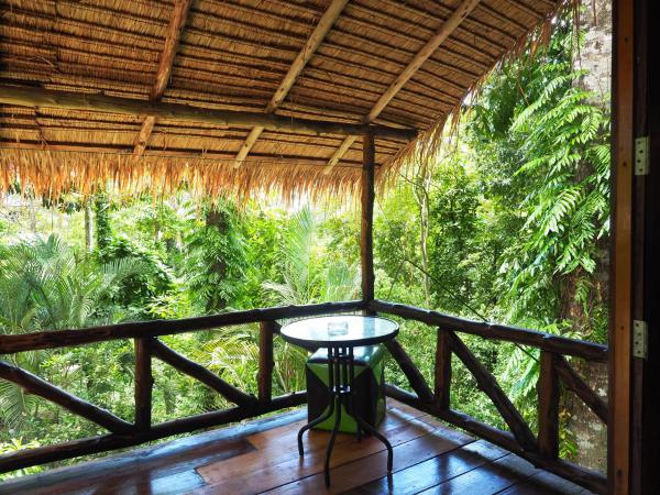 LITTLE EDEN Bungalows : photo 2 de la chambre chambre double ou lits jumeaux - vue sur jardin