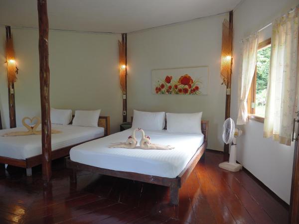 LITTLE EDEN Bungalows : photo 5 de la chambre chambre double ou lits jumeaux - vue sur jardin