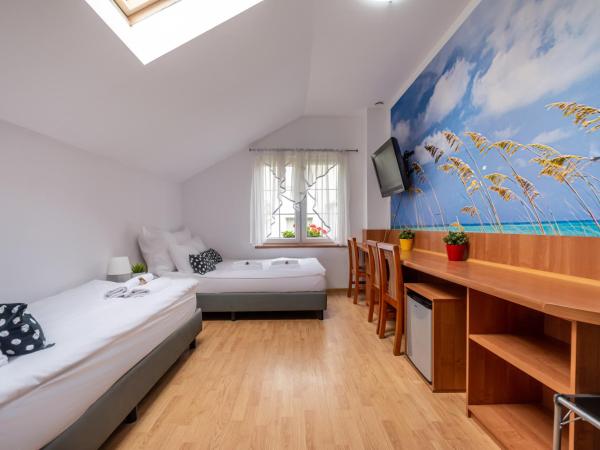 Plac Rybaków Inn : photo 1 de la chambre chambre triple