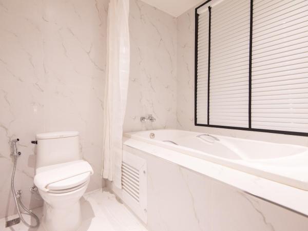 Madison Bangkok Hotel : photo 4 de la chambre chambre lits jumeaux - vue sur jardin