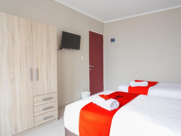 Residences by RedDoorz near MT Haryono - Minimum Stay 7 Days : photo 5 de la chambre chambre lits jumeaux