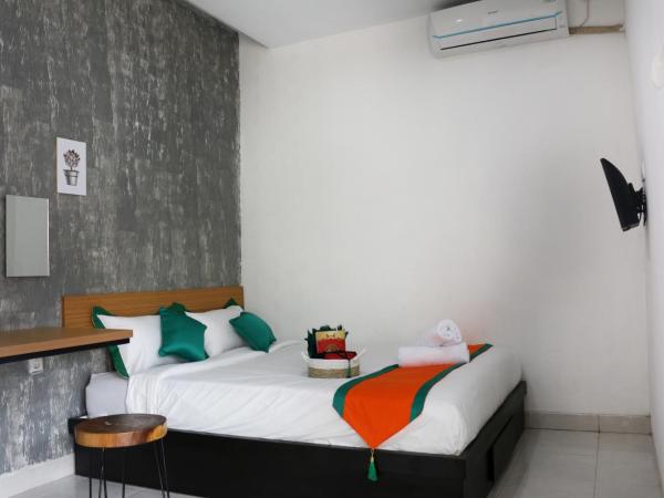 Hotel Jogja Kili Suci By Simply Homy : photo 8 de la chambre chambre supérieure lit queen-size