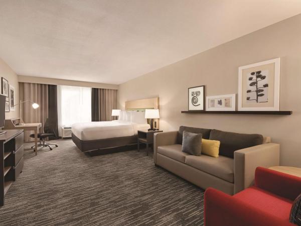 Country Inn & Suites by Radisson, Savannah Midtown, GA : photo 1 de la chambre suite 1 chambre lit king-size avec canapé-lit - non-fumeurs