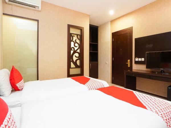 Collection O 252 Istana Permata Ngagel : photo 5 de la chambre chambre lits jumeaux standard