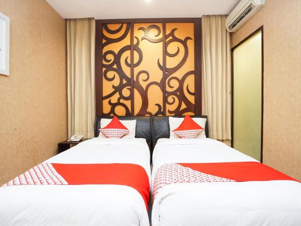 Collection O 252 Istana Permata Ngagel : photo 2 de la chambre chambre lits jumeaux standard