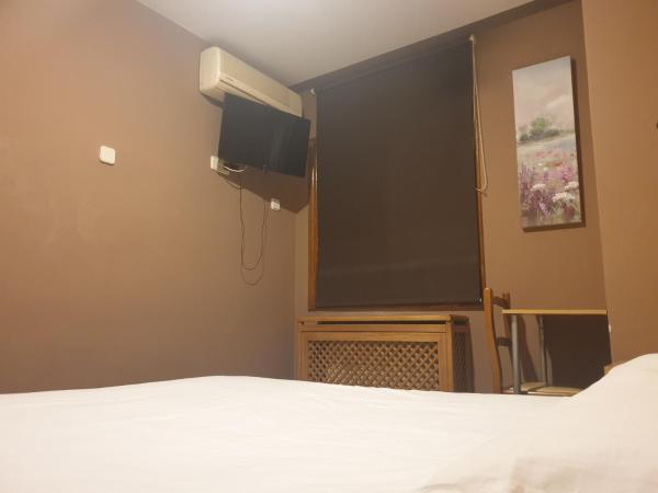 Hostal El Descanso : photo 1 de la chambre chambre lits jumeaux