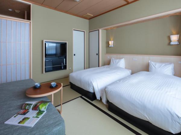 Gion Ryokan Karaku : photo 2 de la chambre chambre lits jumeaux avec tatami