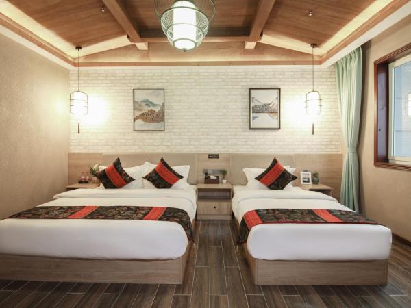 Zou Qu Ye Travel Hotel : photo 2 de la chambre chambre lits jumeaux Économique