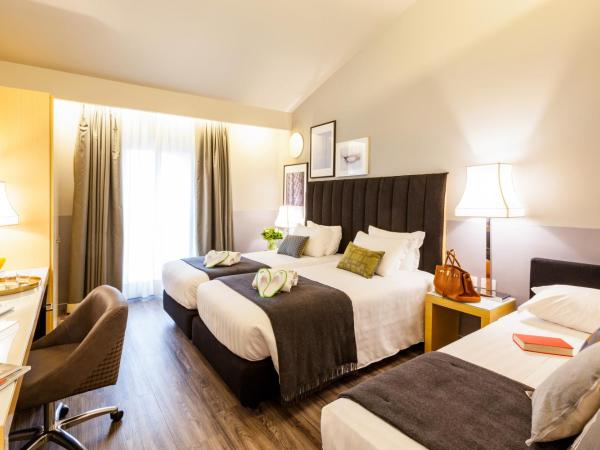 Holiday Inn Milan Garibaldi Station, an IHG Hotel : photo 1 de la chambre chambre lit king-size avec canapé-lit