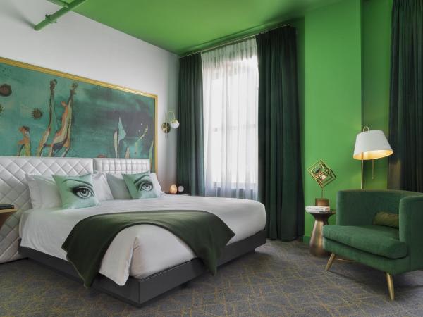 Angad Arts Hotel : photo 1 de la chambre chambre simple lit king-size