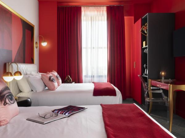 Angad Arts Hotel : photo 1 de la chambre chambre lit queen-size double - moyenne