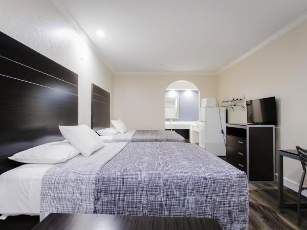 Palace Inn TX-249 : photo 4 de la chambre chambre avec 2 grands lits queen-size