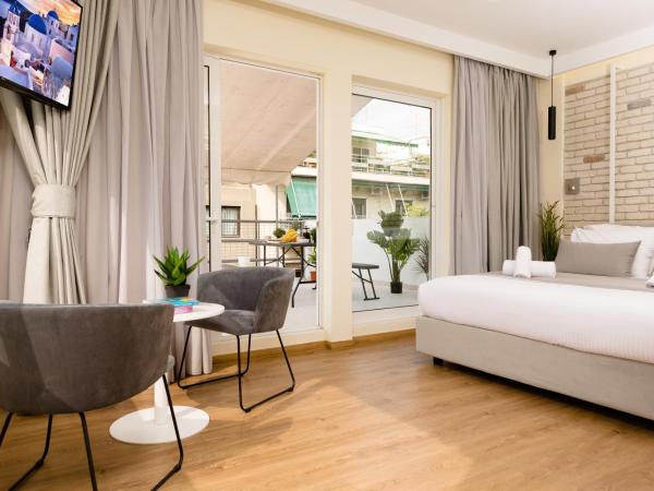 SUITES@SYNGROU-FIX : photo 1 de la chambre suite junior avec balcon