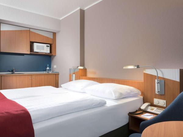 Ramada by Wyndham Hannover : photo 1 de la chambre suite studio queen - non-fumeurs