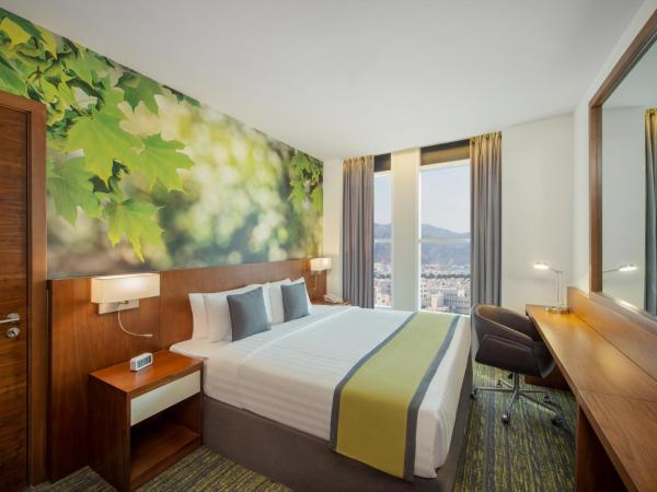 Wyndham Garden Muscat Al Khuwair : photo 4 de la chambre chambre lit king-size - fumeurs