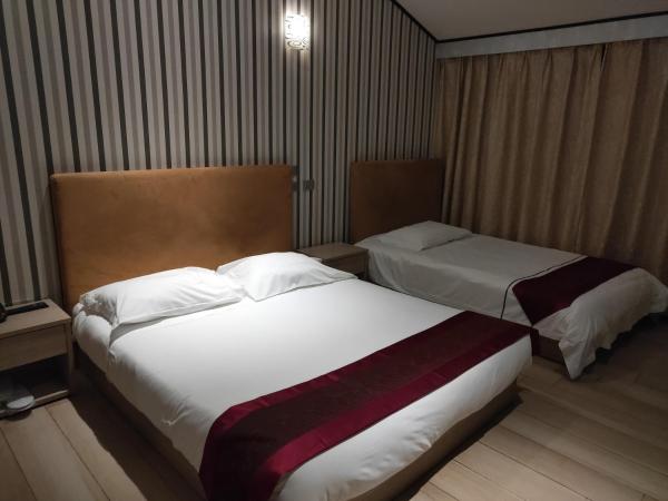 Igiban Hotel : photo 2 de la chambre chambre triple basique