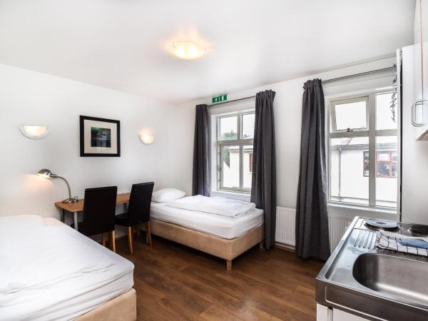 Guesthouse Andrea : photo 6 de la chambre chambre double ou lits jumeaux avec salle de bains commune