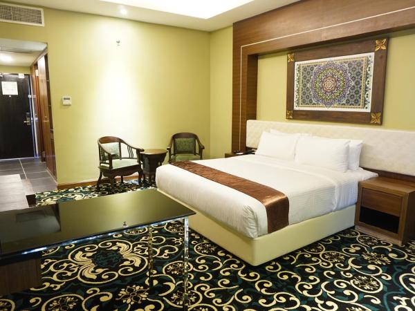 Mudzaffar Hotel : photo 1 de la chambre chambre lit king-size deluxe