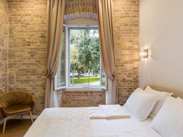 Pellegrini Luxury Rooms : photo 4 de la chambre chambre double deluxe - vue sur jardin