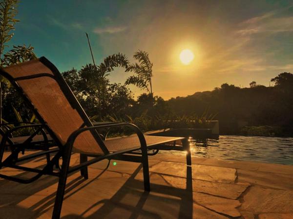 Pousada Villa Canaã : photo 1 de la chambre chambre triple avec balcon
