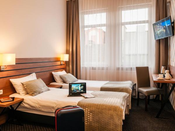 Hotel Wilga : photo 3 de la chambre chambre lits jumeaux avec lit d’appoint - 301