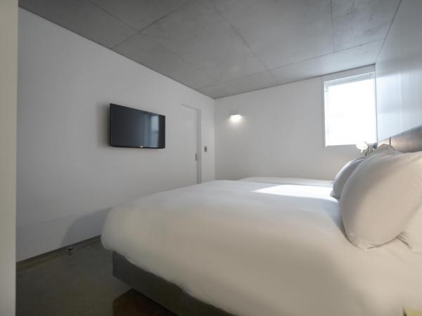 Creto Hotel Myeongdong : photo 3 de la chambre chambre lits jumeaux familiale avec netflix