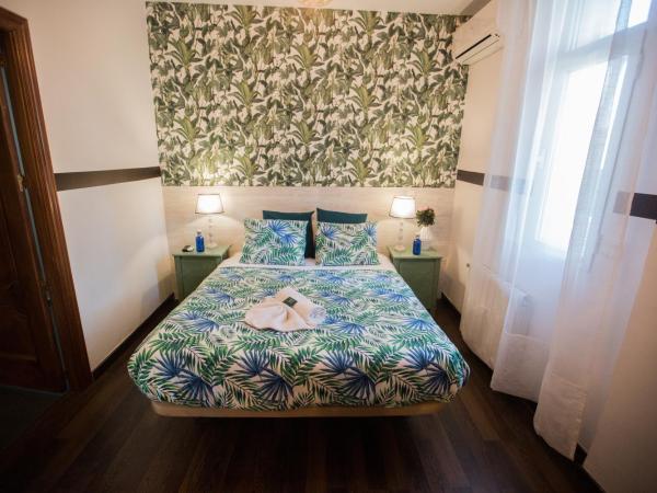 Escala Suites : photo 1 de la chambre petite chambre double intérieure