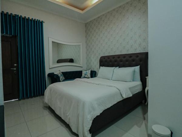 Griya Suryo Wijilan : photo 7 de la chambre chambre lit queen-size deluxe