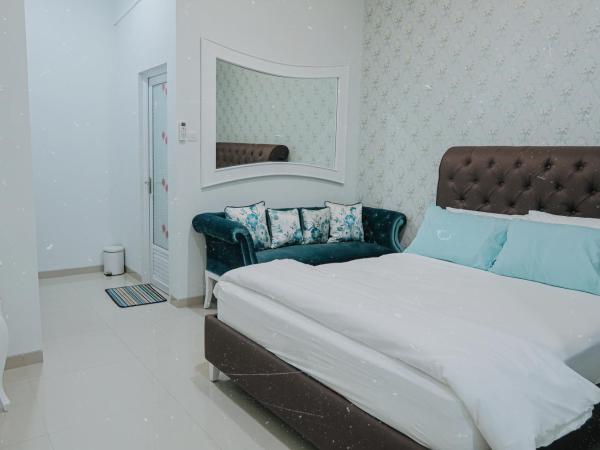 Griya Suryo Wijilan : photo 3 de la chambre chambre lit queen-size deluxe